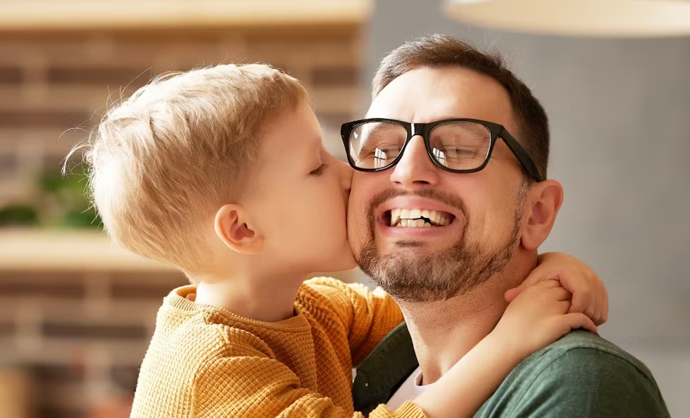 Happy faces: A little boy and his father
