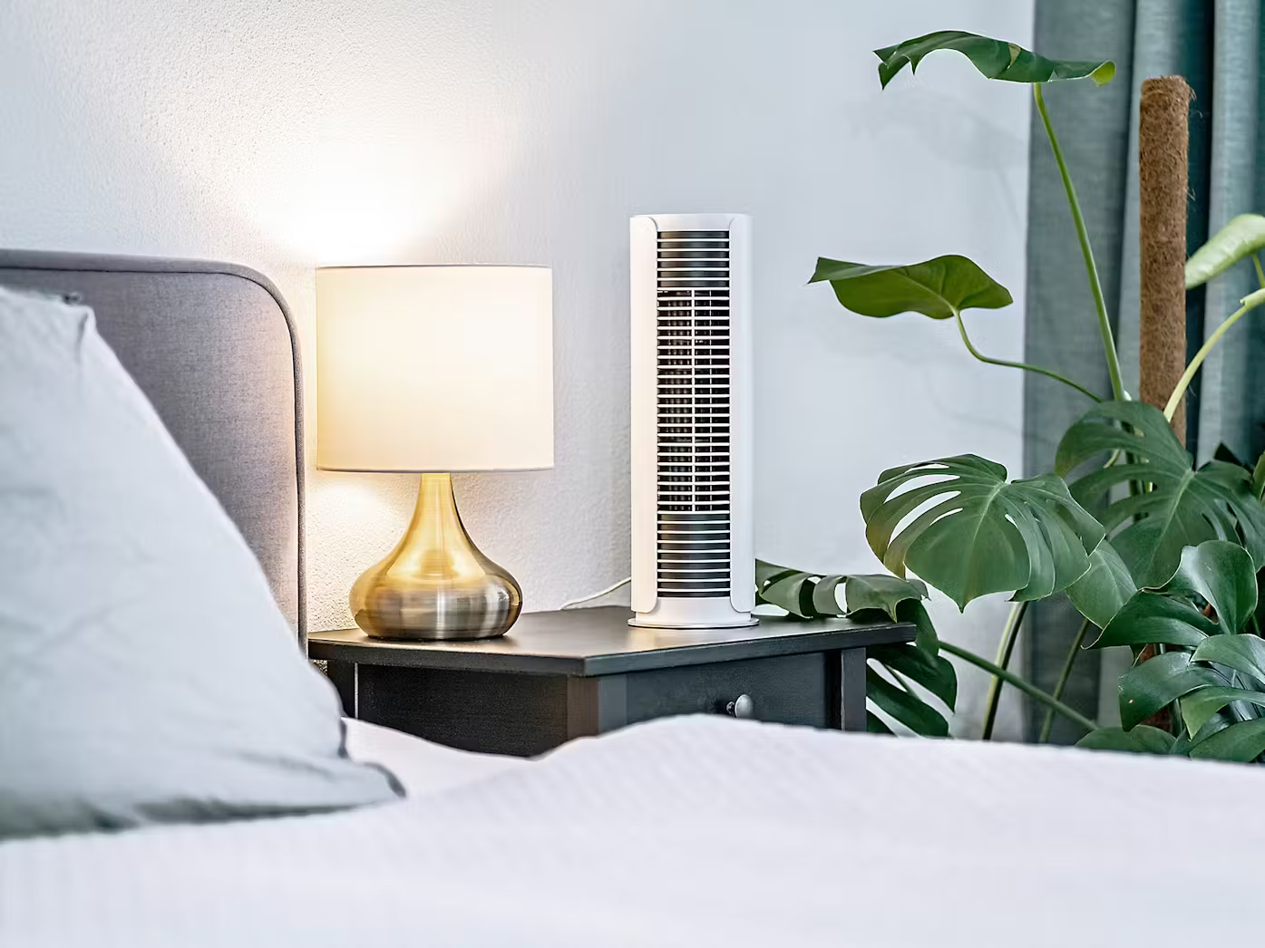 Stadler Form Peter little table fan next to a bed and plants